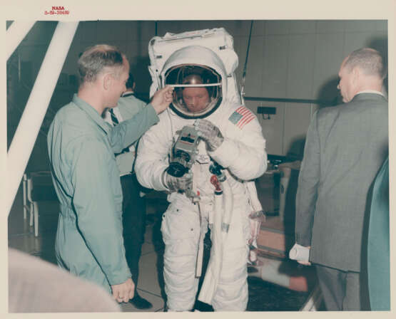 Views of Neil Armstrong examining his Hasselblad camera and simulating the deployment of the lunar surface TV camera, April-June 1969 - photo 1