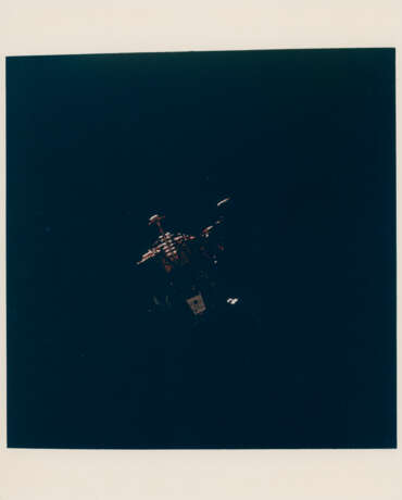 Eagle beginning its descent to the lunar surface; Columbia over the eastern Sea of Tranquility, July 16-24, 1969 - photo 1