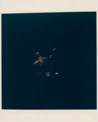 Eagle beginning its descent to the lunar surface; Columbia over the eastern Sea of Tranquility, July 16-24, 1969