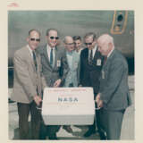 The crew examining the photographic film; NASA officials receiving treasures; scientists studying lunar rocks; ticket parade, July-September 1969 - photo 3