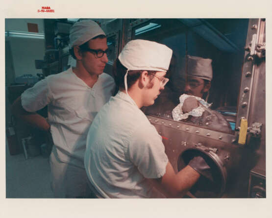 The crew examining the photographic film; NASA officials receiving treasures; scientists studying lunar rocks; ticket parade, July-September 1969 - photo 5