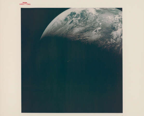Telephotograph of the Crescent Earth; streaked window of the CM; edge of the docked LM, during translunar coast, November 14-24, 1969 - photo 1