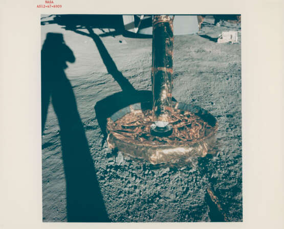 Astronaut shadow and LM footpad; Alan Bean photographing the LM footpad; close-ups of the LM footpad and the descent engine bell, November 14-24, 1969, EVA 1 - photo 1