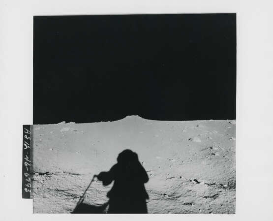 Alan Bean transporting scientific equipment; astronaut’s shadow; the large mound on the Ocean of Storms, November 14-24, 1969, EVA 1 - photo 3