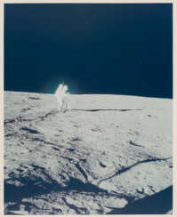 Blue halo around Alan Bean; the Central Station; the lunar atmosphere detector; Bean taking a photograph, at the lunar-science station, November 14-24, 1969, EVA 1