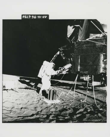 Views of Alan Bean preparing to carry the scientific equipment; Bean and the LM; Bean trying to remove a radioactive fuel element, November 14-24, 1969, EVA 1 - фото 8
