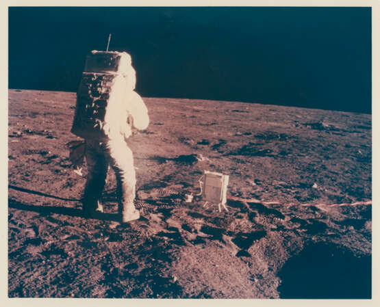Blue halo around Alan Bean; the Central Station; the lunar atmosphere detector; Bean taking a photograph, at the lunar-science station, November 14-24, 1969, EVA 1 - photo 7