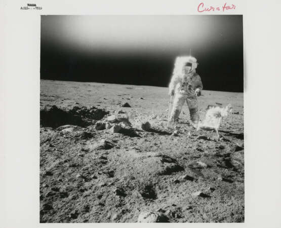 Portraits of Pete Conrad on the rim of Surveyor Crater; the gnomon and the Hand Tool Carrier, November 14-24, 1969, EVA 2 - photo 1
