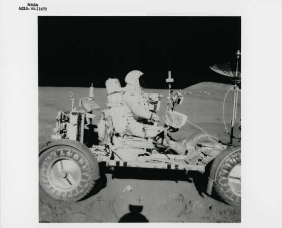 David Scott at his Commander seat of the Lunar Rover; Scott driving the Rover; the Swann Range behind the Rover antenna, July 26-August 7, 1971, EVA 2 - photo 1