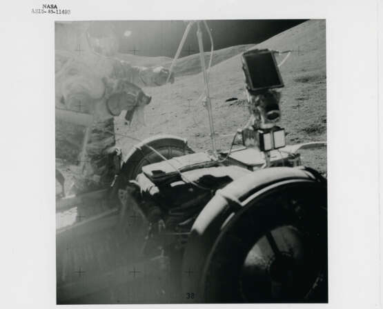 The Lunar Rover with the landing site in the far background; David Scott adjusting the TV antenna towards Earth, station 6, July 26-August 7, 1971, EVA 2 - фото 3