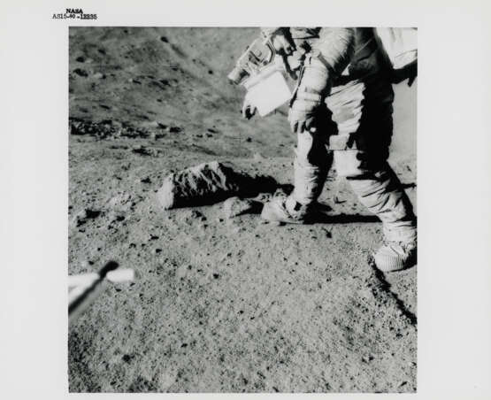 Views of David Scott during geological investigations; TV picture, station 7; the lunar tongs set against a big boulder, station 4, July 26-August 7, 1971, EVA 2 - photo 1