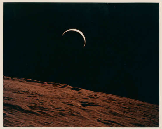 Crescent Earth rising beyond the Moon’s barren horizon, July 26-August 7, 1971 - фото 1