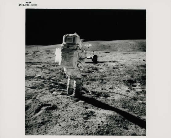 John Young taking photographs near the Rover; TV pictures; footprints; Young with the hammer; Plum Crater, station 1, April 16-27, 1972, EVA 1 - photo 1