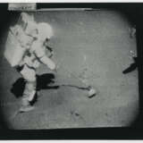 John Young collecting lunar soil; Young at the back of the Rover; boulder, scoop and tongs, station 6; TV picture at station 5, April 16-27, 1972, EVA 2 - photo 3
