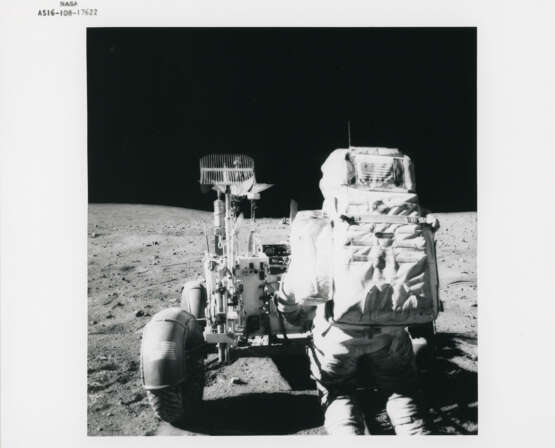 John Young collecting lunar soil; Young at the back of the Rover; boulder, scoop and tongs, station 6; TV picture at station 5, April 16-27, 1972, EVA 2 - photo 5