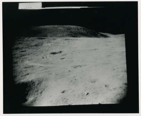 John Young taking photographs near the Rover; TV pictures; footprints; Young with the hammer; Plum Crater, station 1, April 16-27, 1972, EVA 1 - фото 4