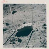 John Young collecting lunar soil; Young at the back of the Rover; boulder, scoop and tongs, station 6; TV picture at station 5, April 16-27, 1972, EVA 2 - фото 7