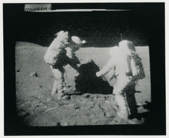 John Young pointing the Rover antenna toward Earth; TV pictures at Wreck Crater; Charles Duke hammering a double core tube, station 8, April 16-27, 1972, EVA 2 - photo 6