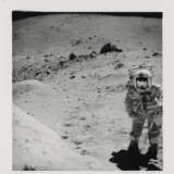 John Young with House Rock in the background; close-ups documenting geological investigations, station 11, April 16-27, 1972, EVA 3 - photo 1