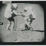 John Young pointing the Rover antenna toward Earth; TV pictures at Wreck Crater; Charles Duke hammering a double core tube, station 8, April 16-27, 1972, EVA 2 - photo 8