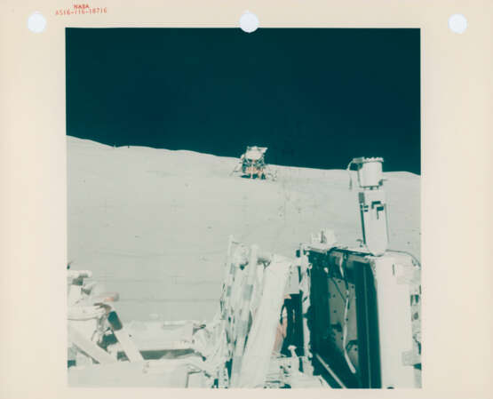Portrait of John Young with the Rover and the US Flag; the Rover parked at its final VIP site facing the landing site, April 16-27, 1972, EVA 3 - photo 3