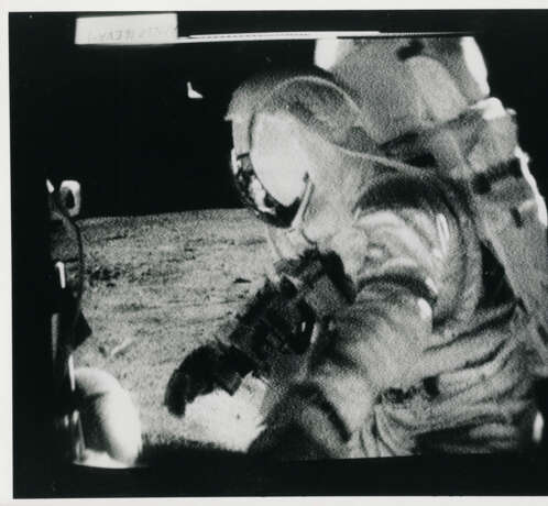 John Young taking photographs near the Rover; TV pictures; footprints; Young with the hammer; Plum Crater, station 1, April 16-27, 1972, EVA 1 - photo 21