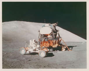 Eugene Cernan on the Rover by the LM; the first photograph after touchdown; lunarscape; Cernan testing the Rover, December 7-19, 1972, pre EVA 1, EVA 1