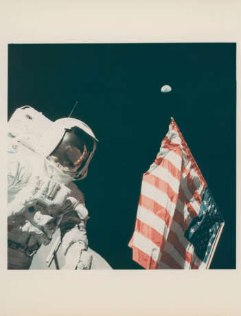 Harrison Schmitt with the Earth above the US flag; portrait of Eugene Cernan holding the US flag, December 7-19, 1972, EVA 1 - photo 1