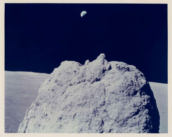The majestic Earth above a large lunar boulder; diptych of a rock; TV picture of the Earth; Nansen Crater, station 2, December 7-19, 1972, EVA 2 - photo 1