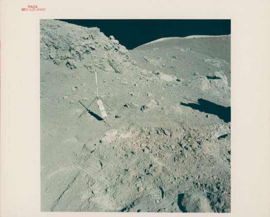 Orange soil near Shorty Crater; lunarscape towards the South Massif; blurred photograph; Harrison Schmitt near the Rover, station 4, December 7-19, 1972, EVA 2 - фото 1