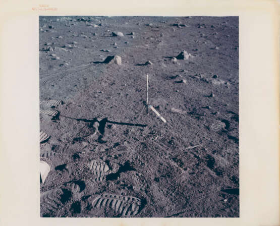 Harrison Schmitt holding the rake; TV pictures; the rim of Steno Crater; footprints; the rising Sun illuminating the Rover, station 1, December 7-19, 1972, EVA 1 - фото 9