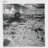 Harrison Schmitt holding the rake; TV pictures; the rim of Steno Crater; footprints; the rising Sun illuminating the Rover, station 1, December 7-19, 1972, EVA 1 - фото 11