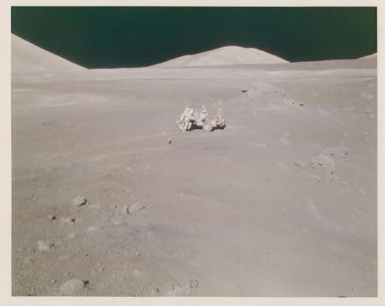 Orange soil near Shorty Crater; lunarscape towards the South Massif; blurred photograph; Harrison Schmitt near the Rover, station 4, December 7-19, 1972, EVA 2 - photo 7