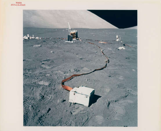 Views of experiments at the lunar-science station; Eugene Cernan and the Rover at the VIP site beyond the LM Challenger, December 7-19, 1972, EVA 3 - Foto 6