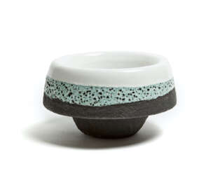 Circular ceramic vase decorated