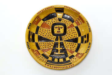 Decorative enameled plate in shades of ocher yellow and brown