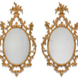 A PAIR OF GEORGE III GILT CARTON PIERRE OVAL MIRRORS - photo 1