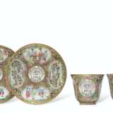 A RARE PAIR OF 'CANTON FAMILLE ROSE' DATED AND INITIALED TEA CUPS AND SAUCERS - фото 1