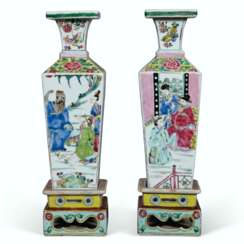 A RARE PAIR OF FAMILLE ROSE QUADRANGULAR VASES AND STANDS