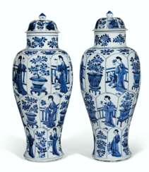 A LARGE PAIR OF BLUE AND WHITE BALUSTER VASES AND COVERS