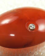 Anneaux. CARNELIAN cabochon with incrusted diamond.