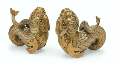 A PAIR OF SILVER-GILT FIGURES OF DOLPHINS