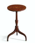 Incrustation. A FEDERAL EAGLE INLAID MAHOGANY TILT-TOP CANDLE STAND