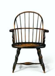 A TURNED AND PAINTED SACK-BACK WINDSOR ARMCHAIR