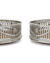 A PAIR OF GEORGE III SILVER WINE COASTERS