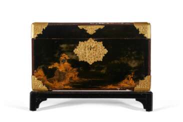 A JAPANESE BLACK AND GILT LACQUER CHEST ON STAND