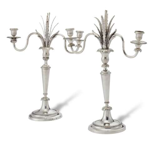 A PAIR OF RUSSIAN SILVER TWO-LIGHT CANDELABRA - фото 1