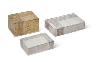 TWO RUSSIAN PARCEL-GILT SILVER AND ONE SILVER-PLATE TROMPE L’OEIL CIGAR BOXES