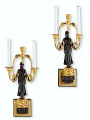 A PAIR OF EMPIRE ORMOLU AND PATINATED-BRONZE TWIN-BRANCH WAL...