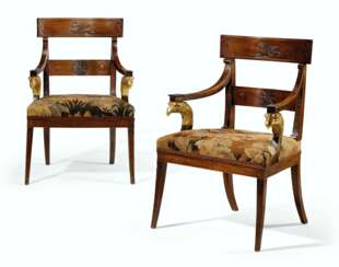 A PAIR OF NORTH EUROPEAN MAHOGANY AND PARCEL-GILT ARMCHAIRS ...